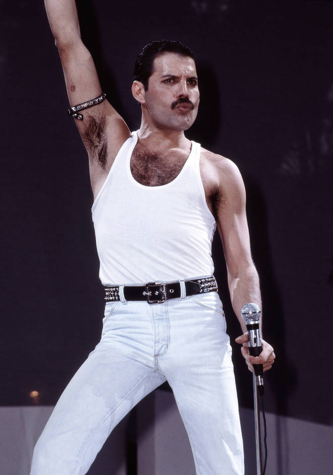 Freddie Mercury performs on stage at Live Aid at Wembley Stadium on 13th July 1985 in London.
