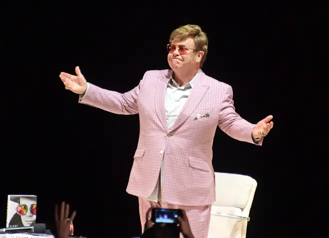 Sir Elton John speaking to the audience in Hammersmith